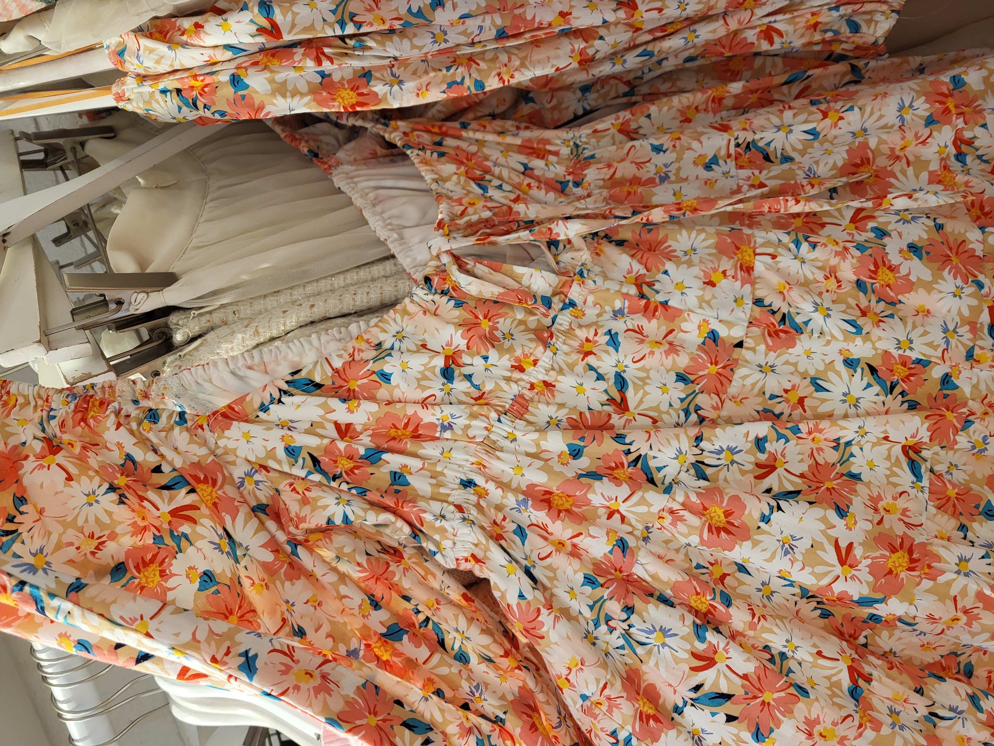 a shirt with warm coloured floral patterns on it.